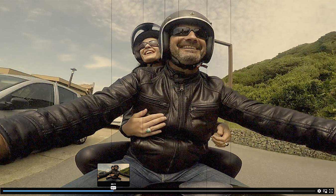 Couple de motards souriant en liberté sur la route, incarnant l'esprit d'aventure de la collection de bagues biker d'Aden
